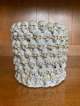Load image into Gallery viewer, Wall of Skulls Cement Planter
